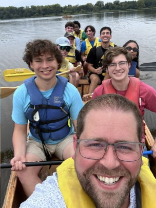 Honors College Impact Day Boat Trip: Group of smiling students in canoe
