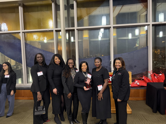 Diallo presenting an award to the leadership team for the Association of Black Women Lawyers of New Jersey in the fall of 2024.