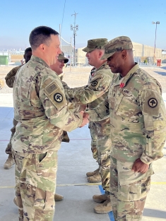 Gaines receives an award for service.