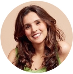 Brisa De Angulo, Commencement Speaker for Rutgers School of Law is smiling in front of a beige background.